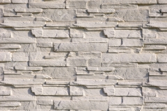 White cladding tiles imitating stones